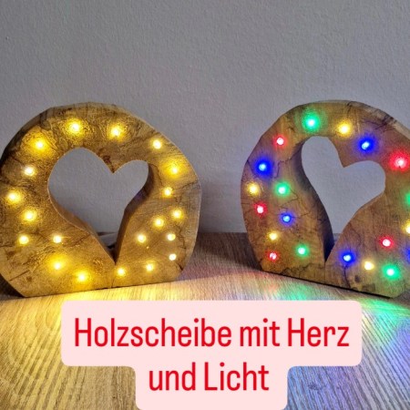 Holzscheibe mit Herz und Licht