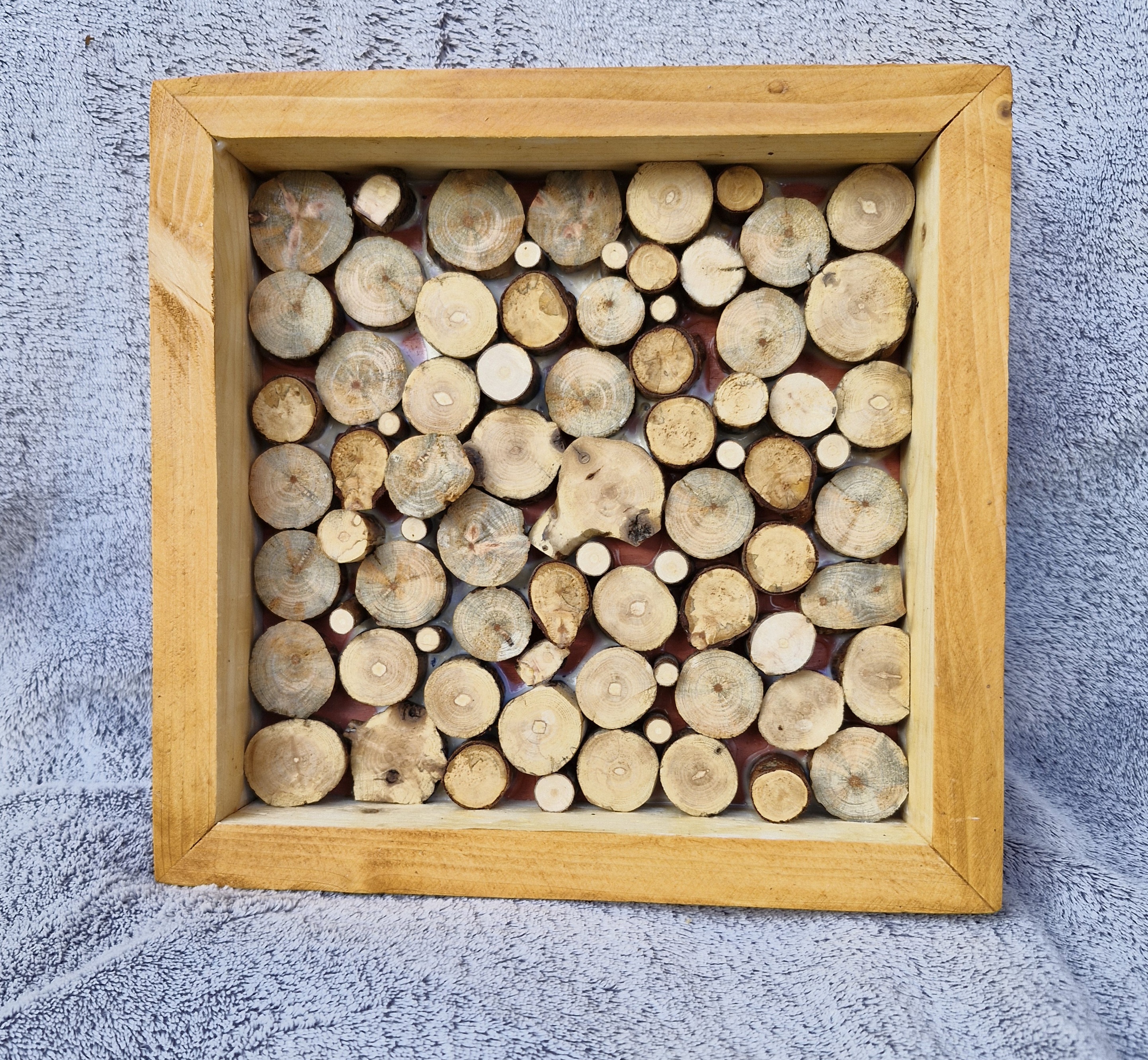 Kleines Rahmenbild aus Holzscheiben